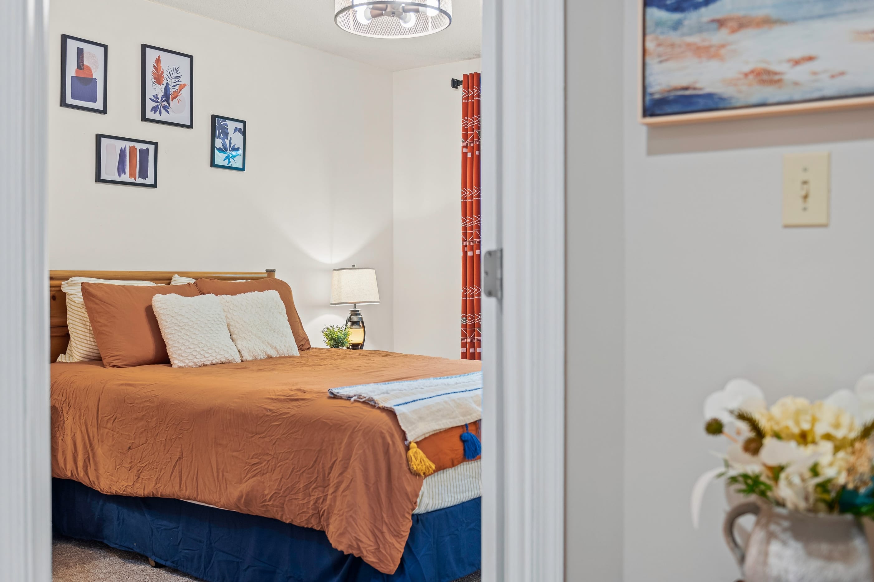 Bedroom 2 features a queen bed.