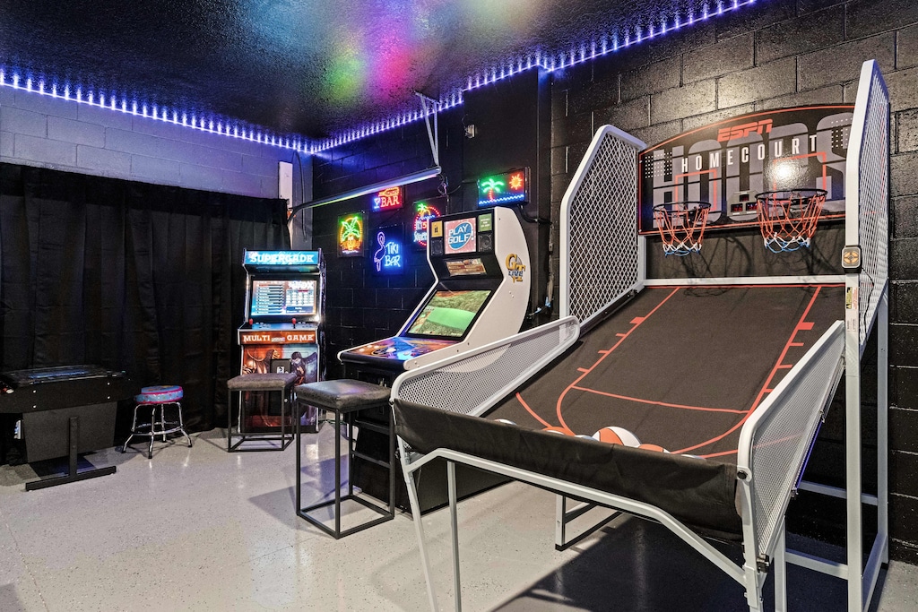 Play your way through a variety of arcade classics in our game room in Kissimmee - Challenge your friends and family to a game night in our arcade room. - Entertainment galore awaits in our arcade room.