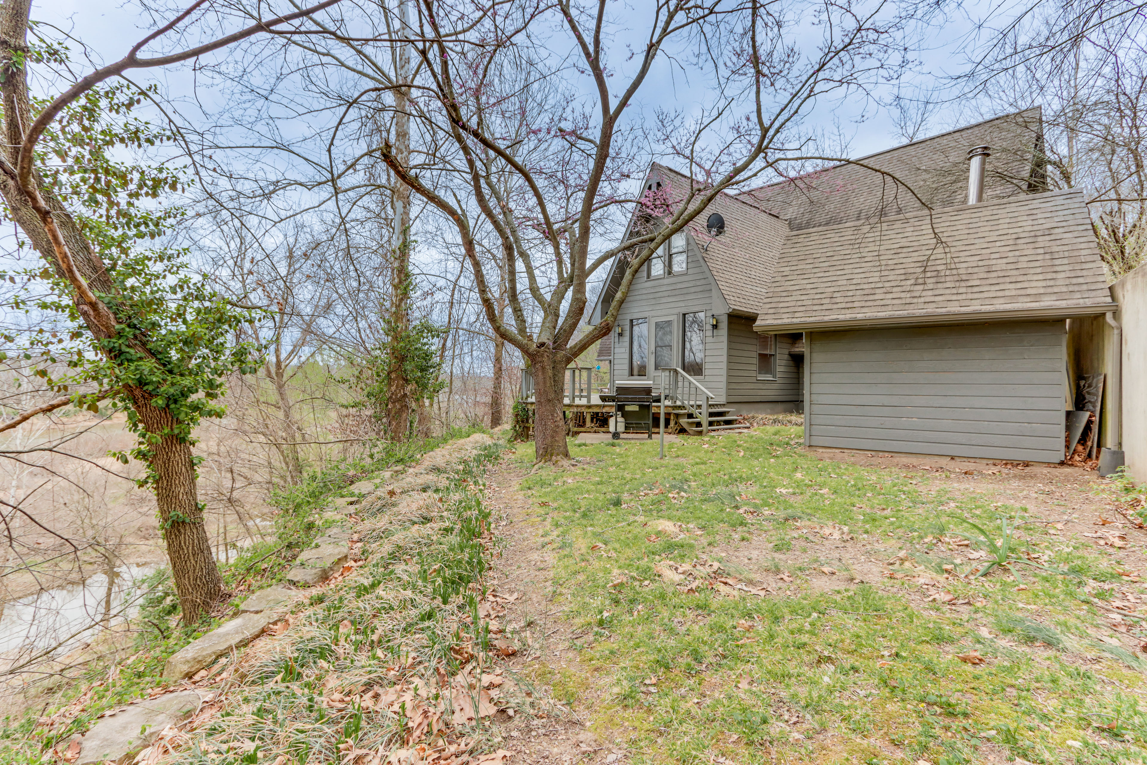 Property Image 2 - Riverfront Baxter Springs Home w/ Deck & Grill!