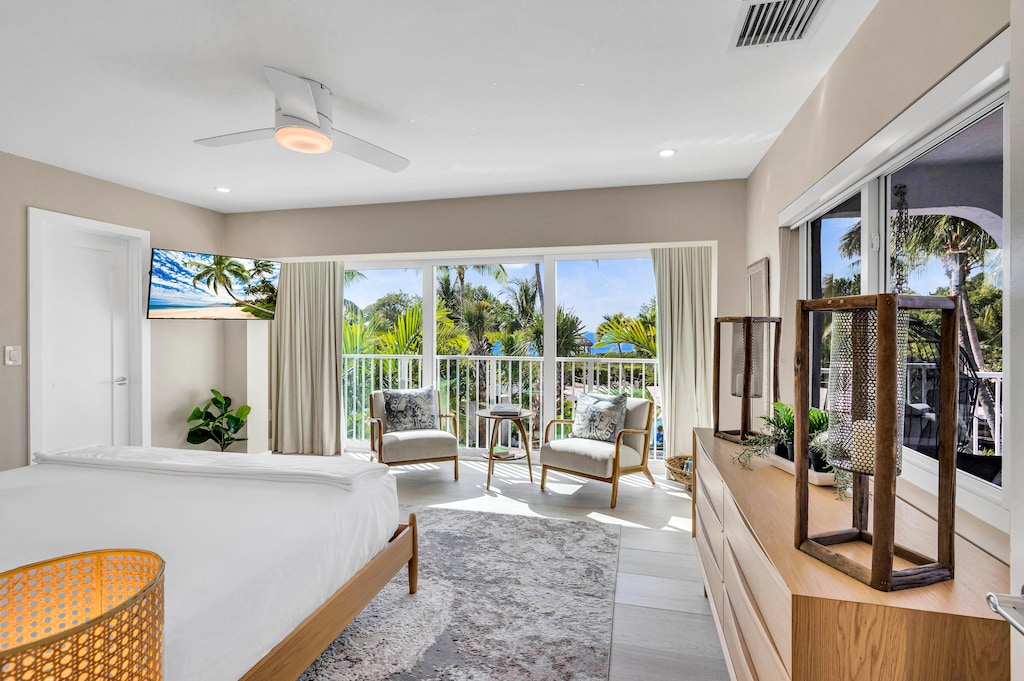 The second floor bedroom boasting ocean views overlooks the heated pool and the grand garden.