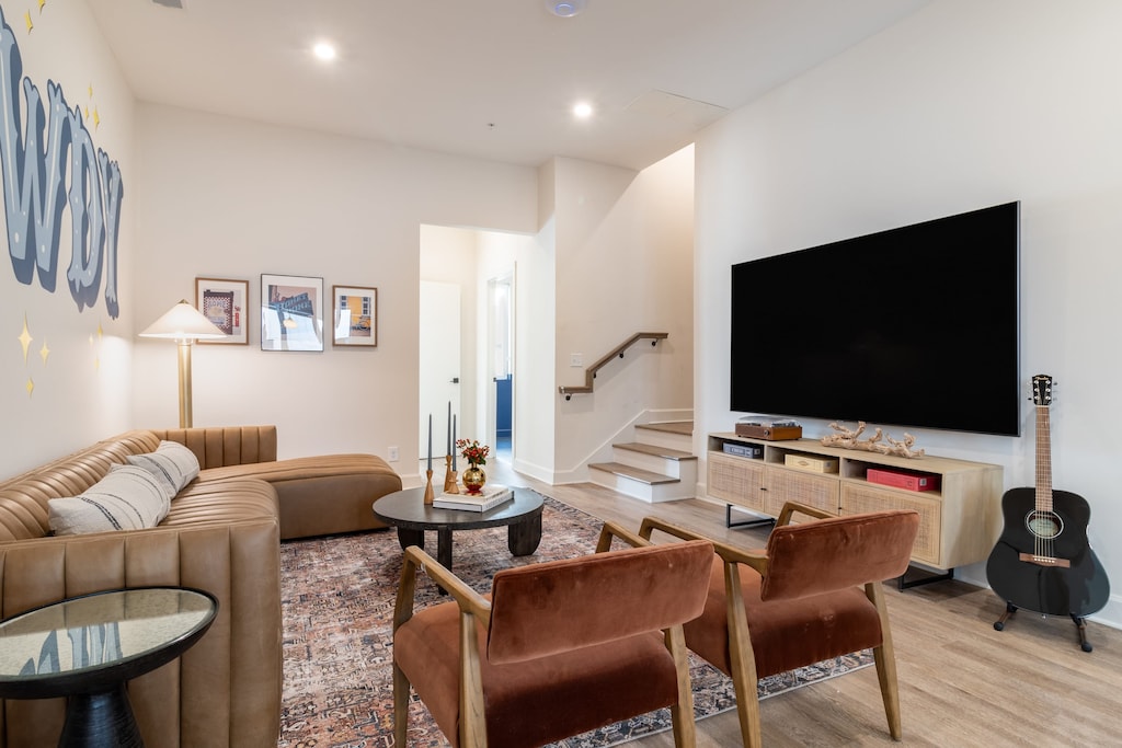 Main living area features ample seating and a flat-screen TV.