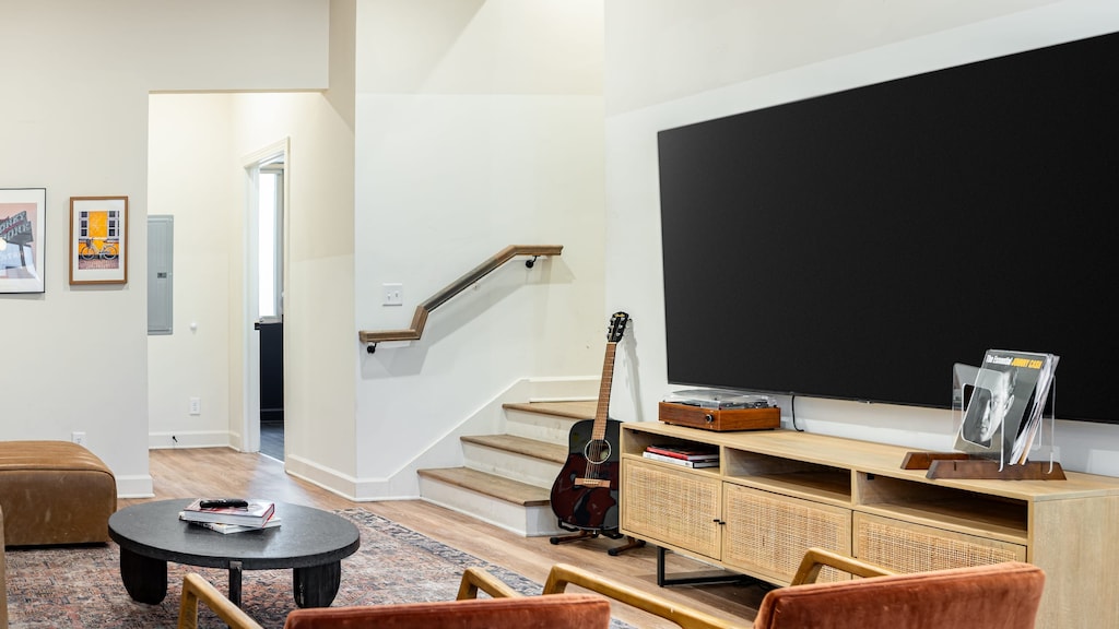 Main living area features ample seating and a flat-screen TV.