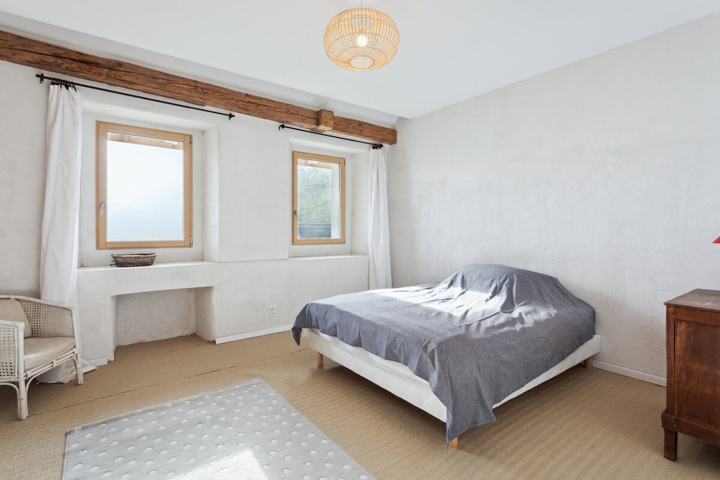 Simple, cozy bedroom with a minimalist style.