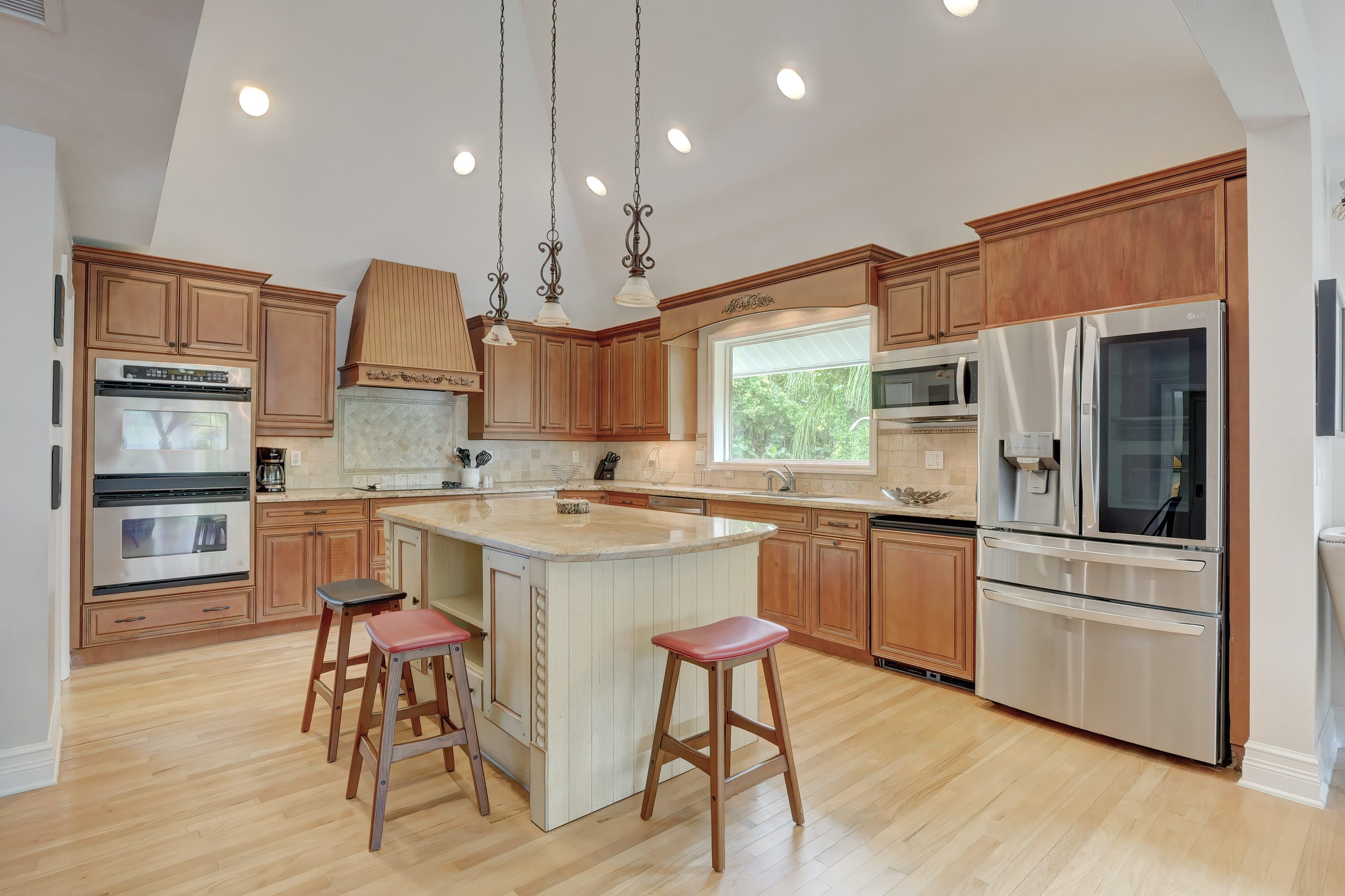 Our Kitchen Features Tall Ceilings, Stainless Appliances and A Large Center Island