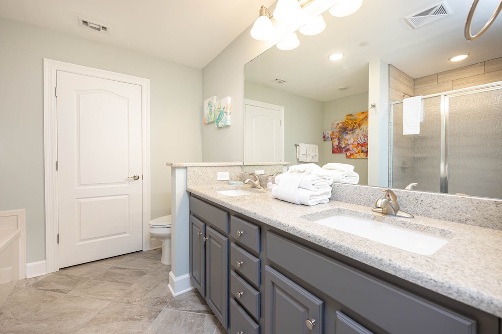 Refresh in the master bath after a day at the beach with a soothing jetted tub and walk-in shower