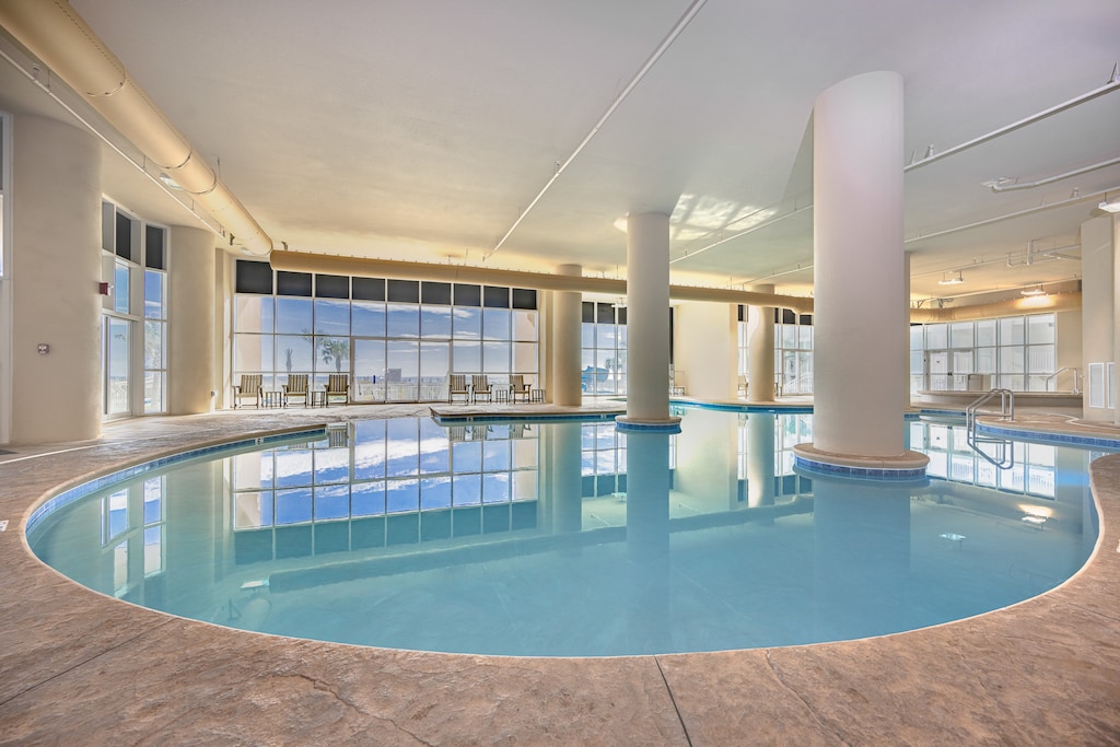 Dip into the indoor pool areas with large windows showcasing stunning beachfront views and comfortable seating