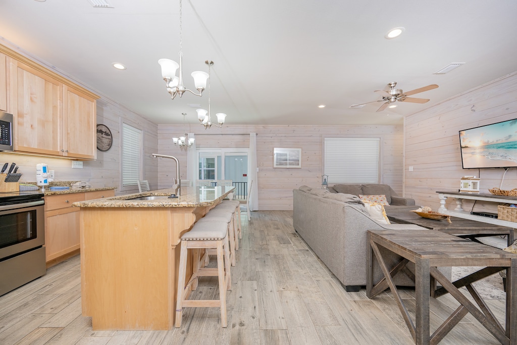 Cozy living space featuring a modern kitchen with granite countertops and cozy seating area for relaxation