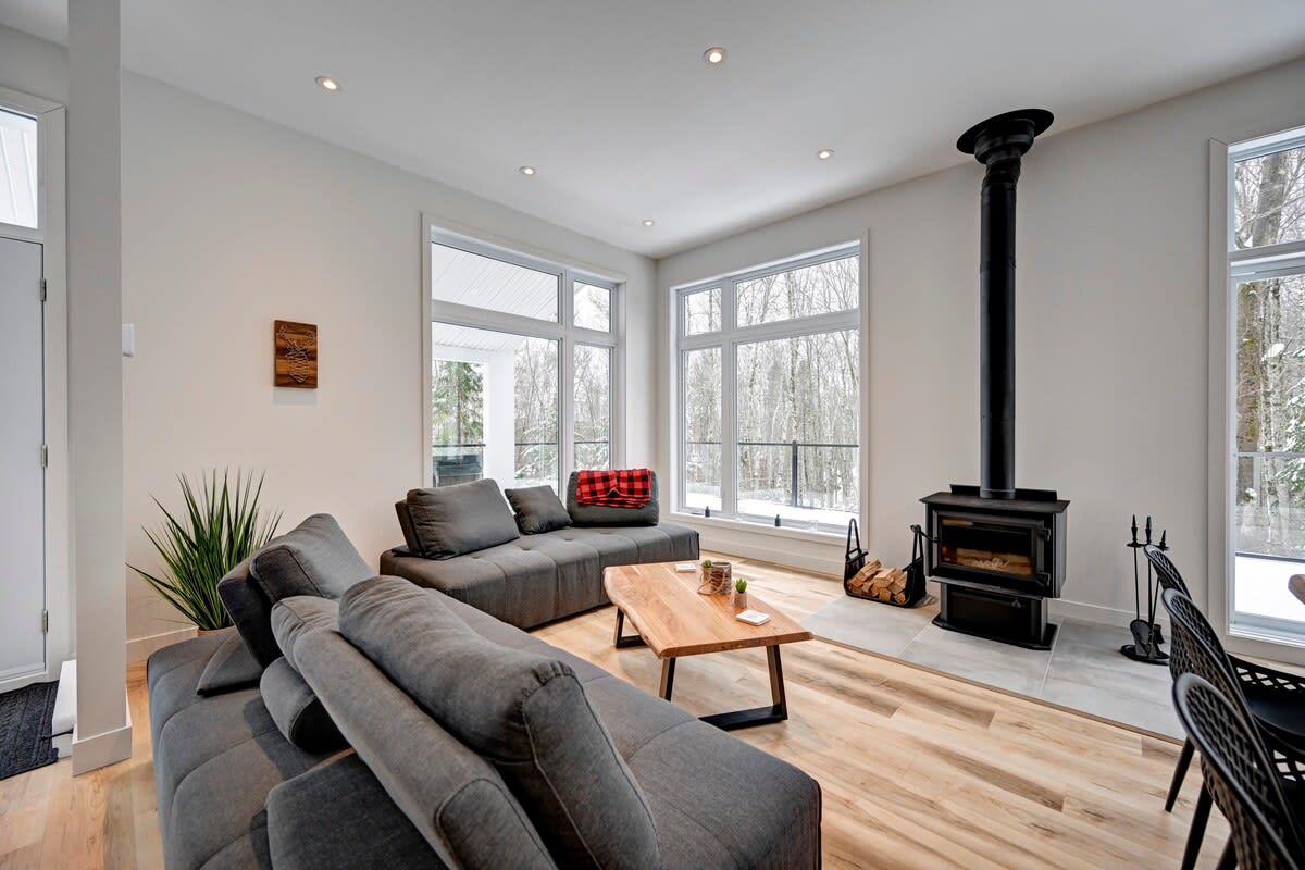 Warm, inviting living space with wood fireplace.