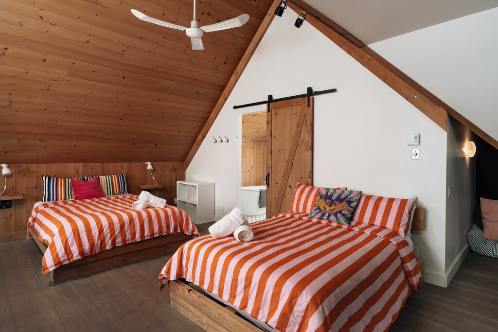 Ascend to spirited dreams. This bright mezzanine invites joyful repose.