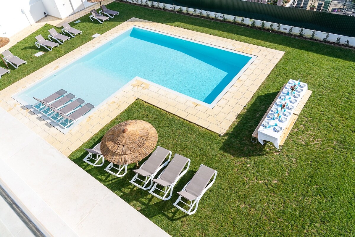 Outdoor space with swimming pool, leisure and dining area.