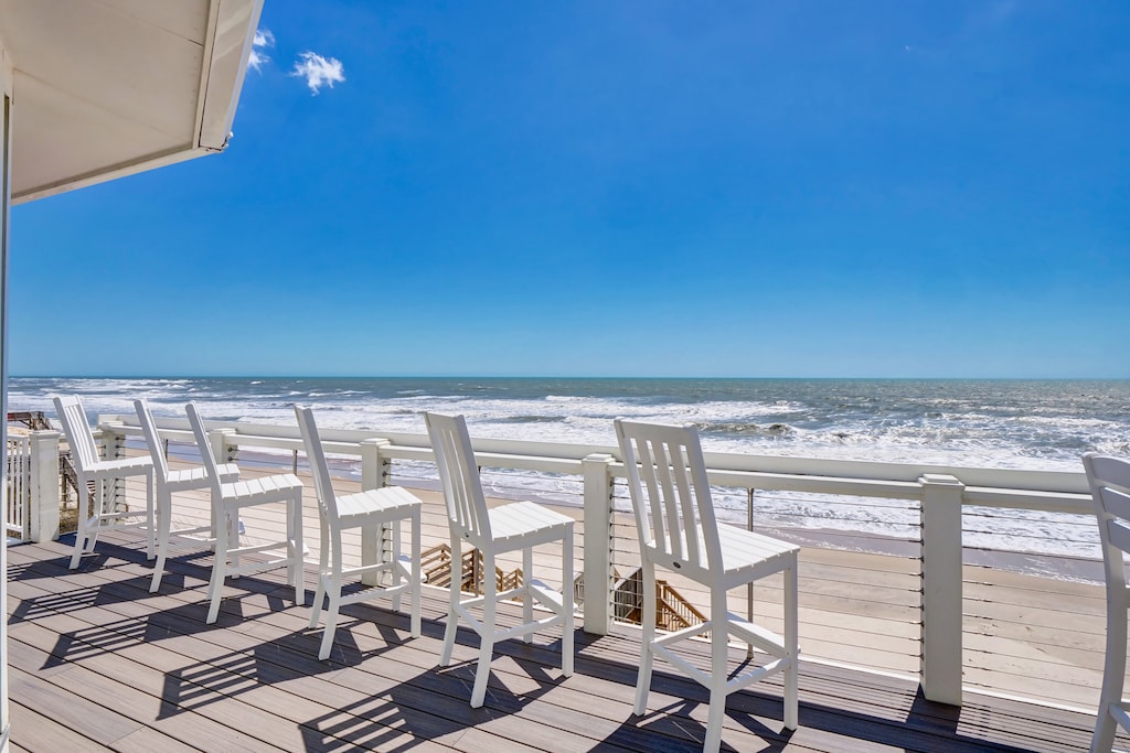 outside chairs on the deck to enjoy the panoramic ocean views