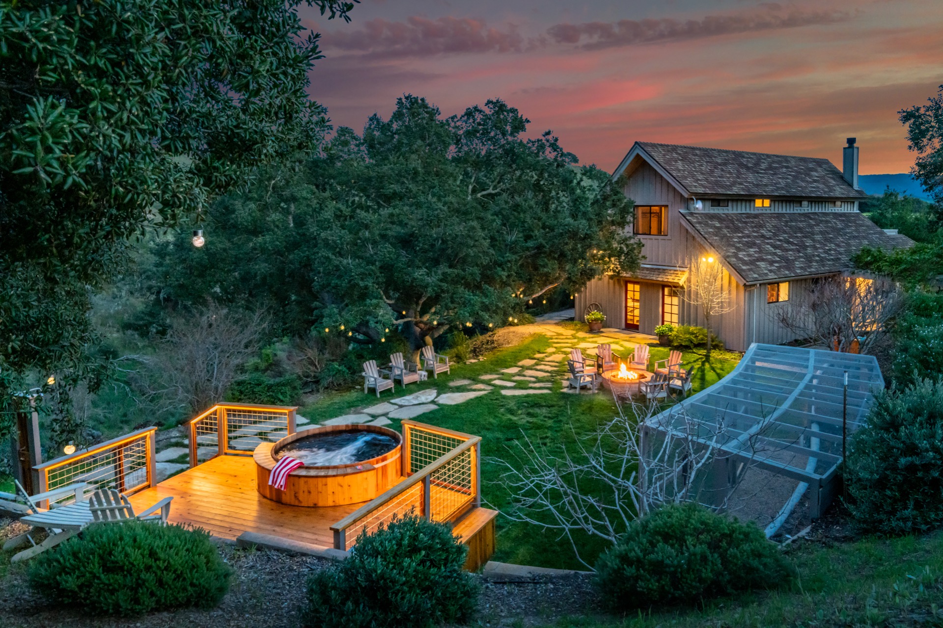 Backyard area with cedar hot tub, sauna, and firepit
