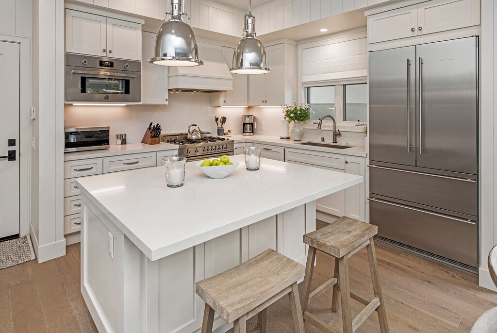 Spacious and bright Kitchen with stainless steel appliances and breakfast bar.