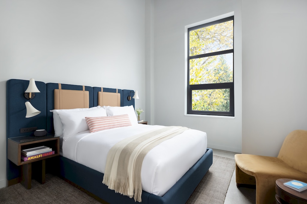 King Bed, armchair/footstool, large closet, hangers, window with blackout shades, luggage rack, noise cancelling machine, bedside lamps, easily accessible charging stations. 