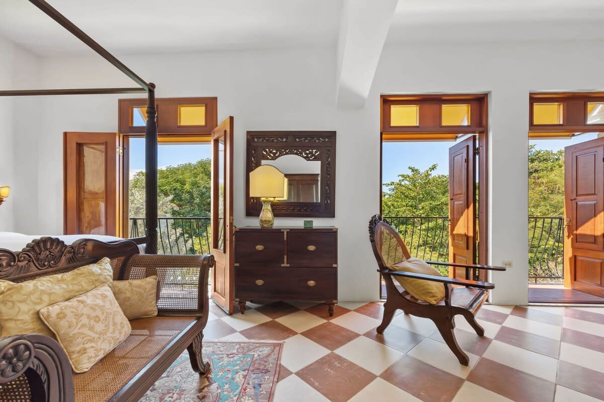 Master Suite with king bed and spectacular view of the lush vegetation.