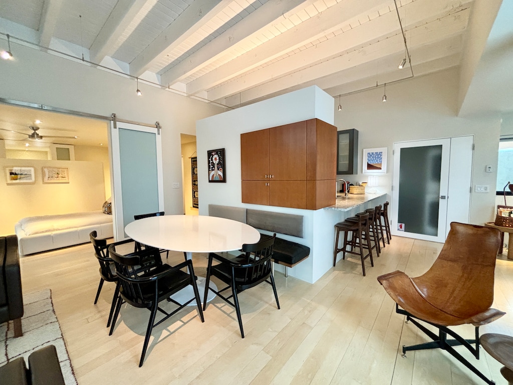 A kitchen and dining area in a modern apartment.
