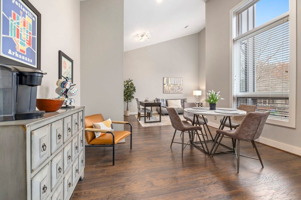 Our large living area features plush seating, a desk, and a 55-inch Smart TV.