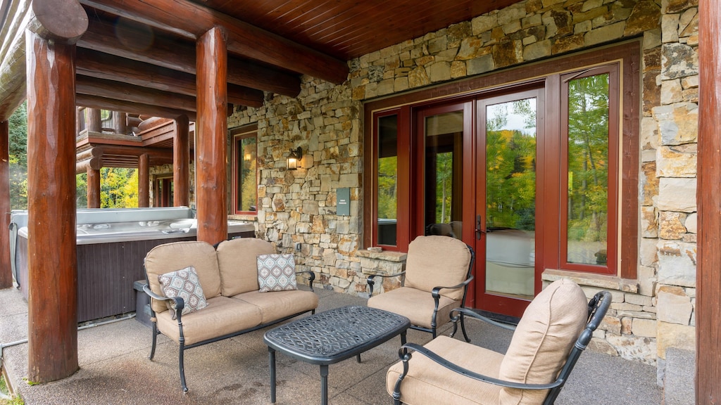Patio and lounge area near the hot tub.