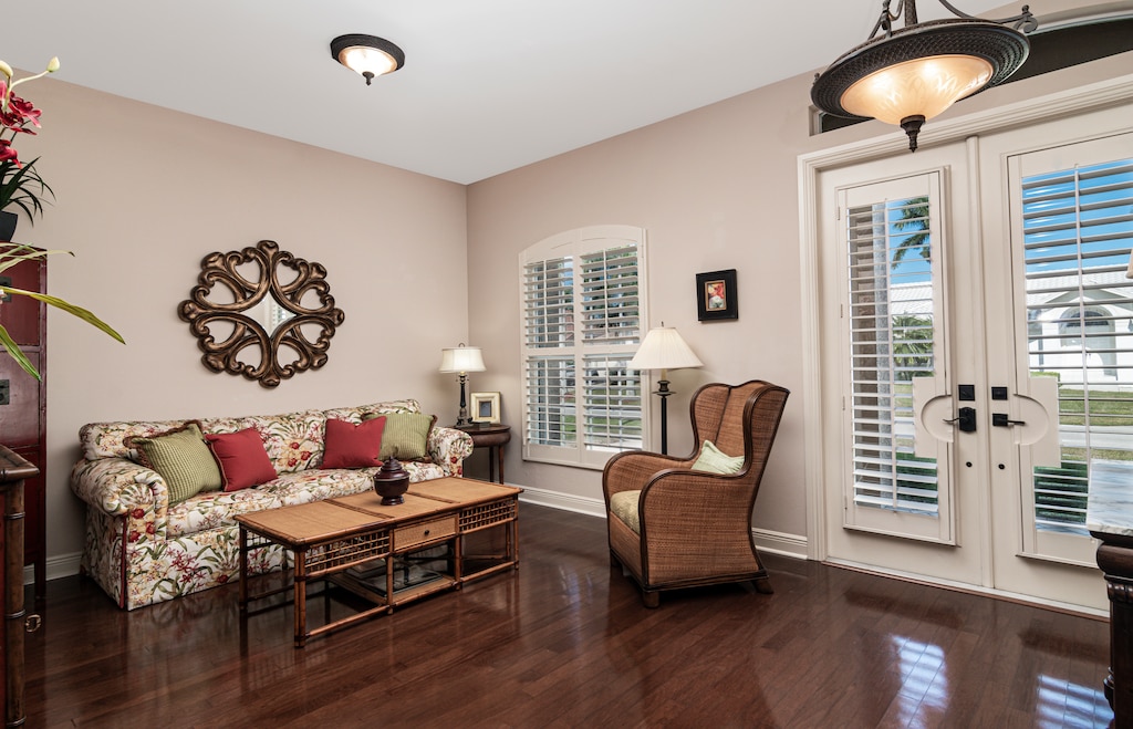 Warm wood floors and elegant furnishings welcome you into this open-concept coastal haven.
