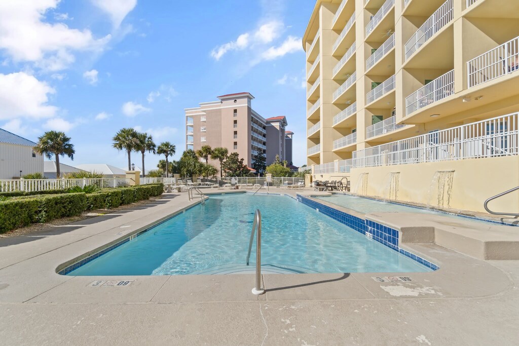 Community outdoor pool with hot tub.