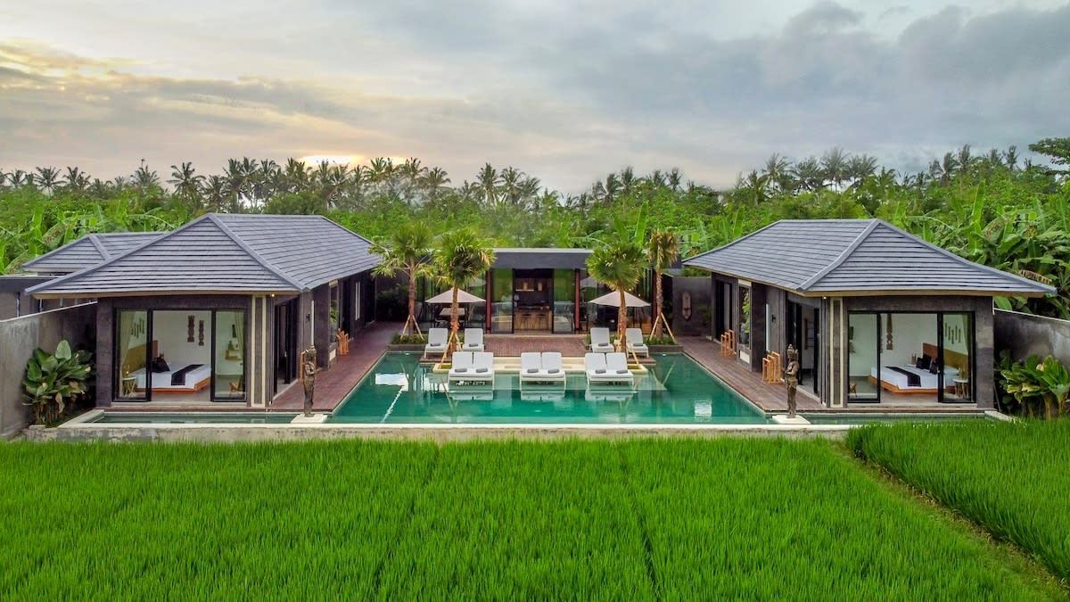 Drone view of the villa’s front and rice field panorama 