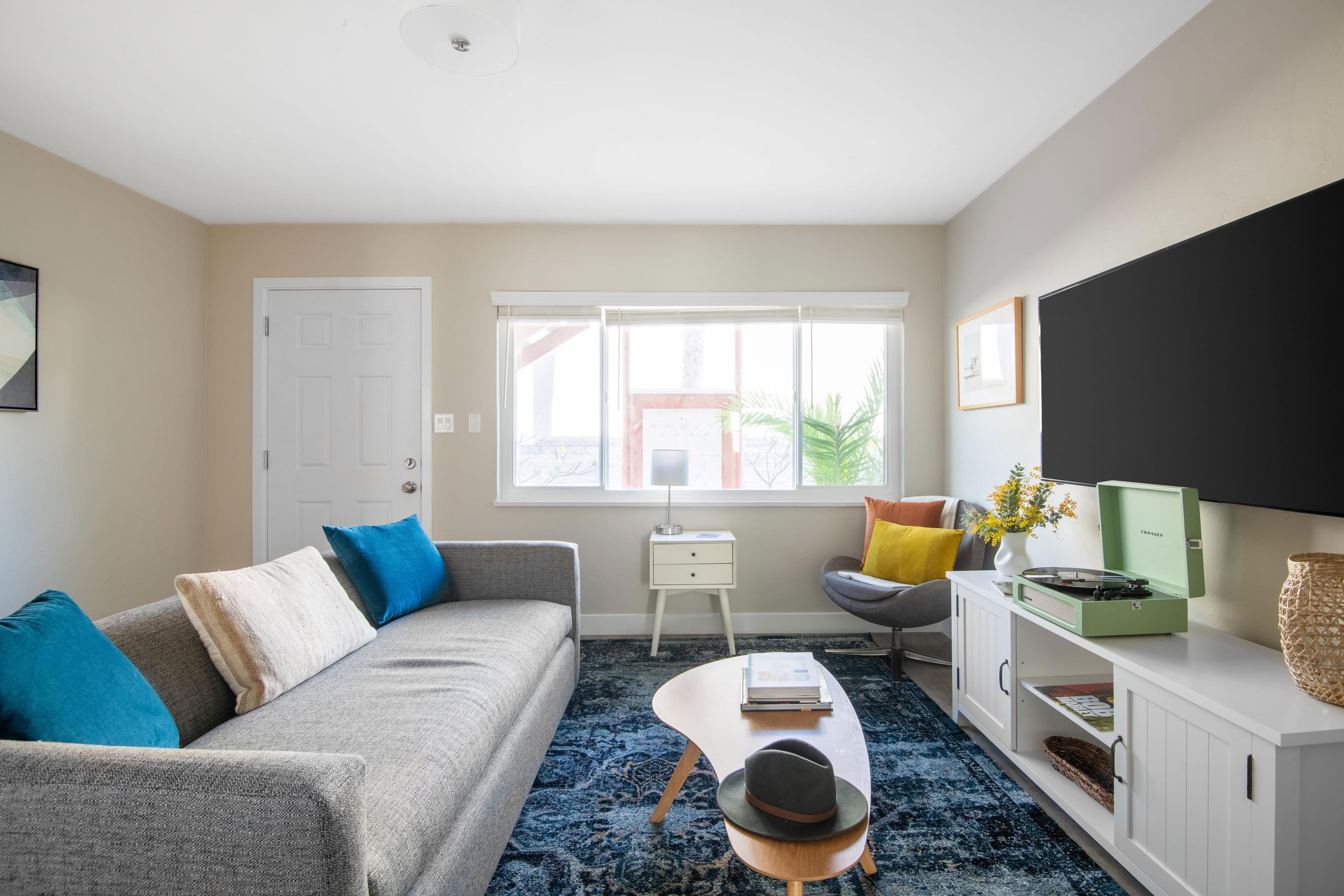 Living room at Seashore I features a couch and TV.