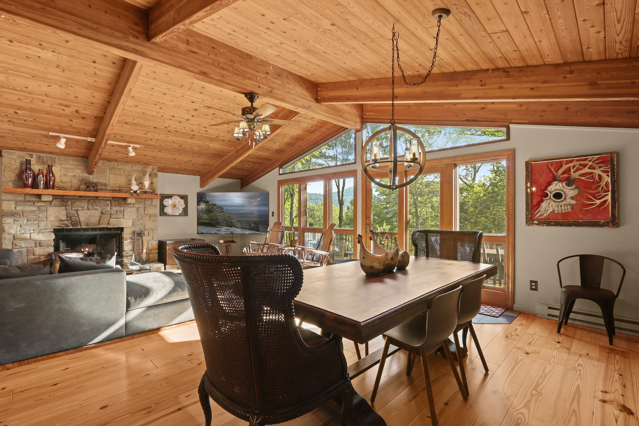 The cozy dining area, adjacent to the living room, features a rustic dining table. Choose to stay in, savoring home-cooked meals in this inviting space.