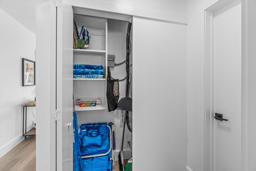 Beach chairs, an umbrella, beach towels and a cooler are provided