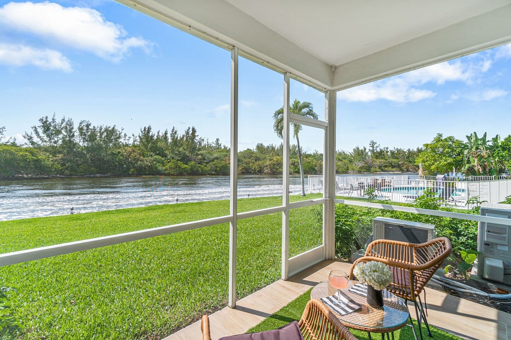 Sunset views and easy access tpo the lawn and swimming pool. There is a screen that keeps the bugs away.