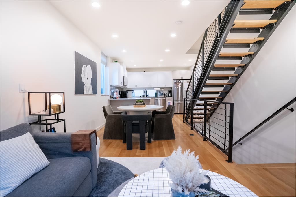 The second-floor living space features an open floor plan