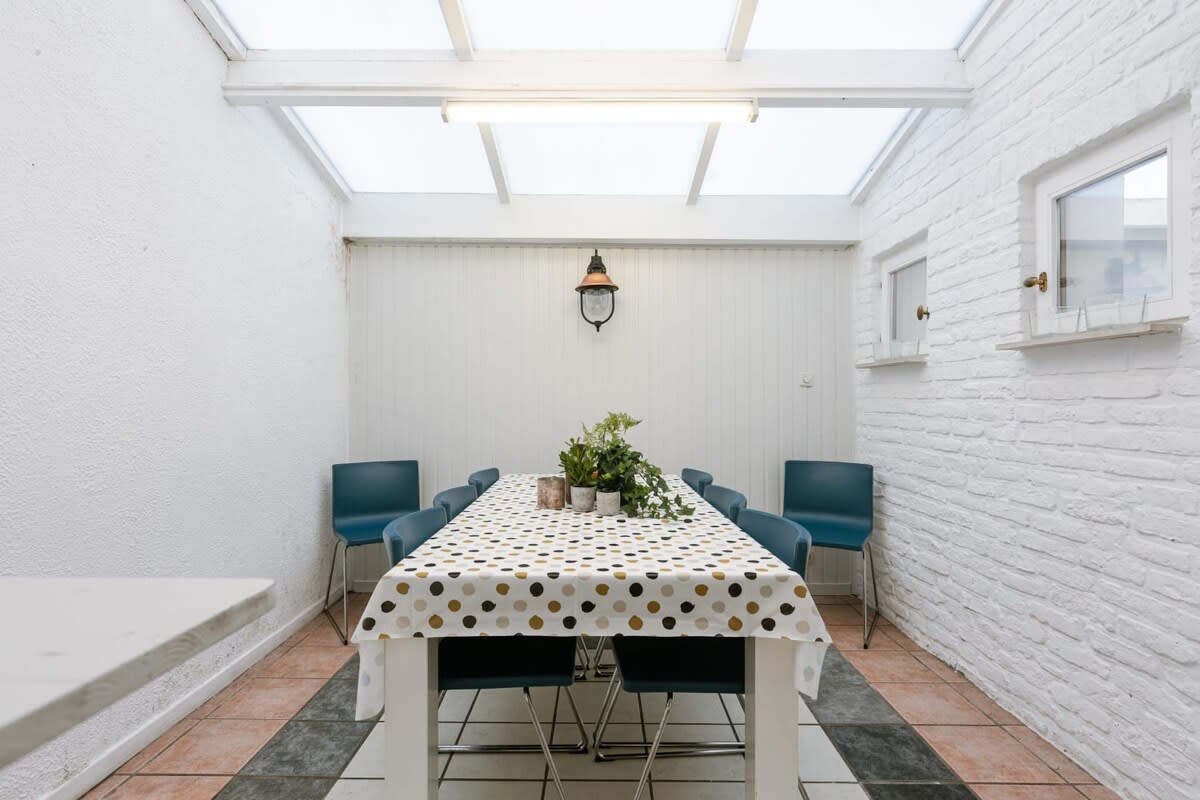 Light-filled porch with dining area