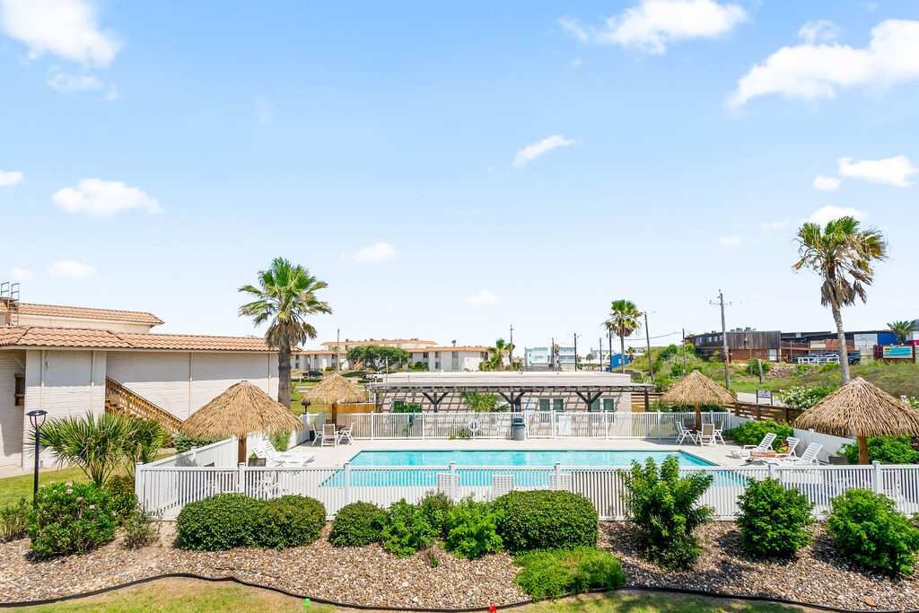 Dive into fun and relaxation at the community pool, a refreshing highlight of your stay.