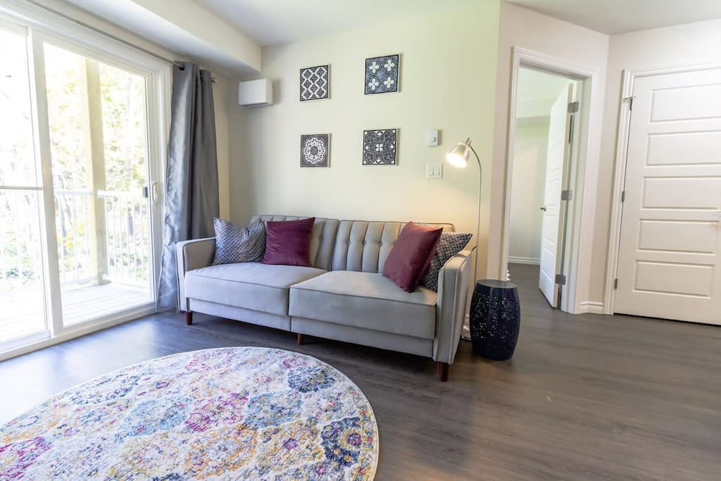 Bight, spacious living room with walkout private balcony