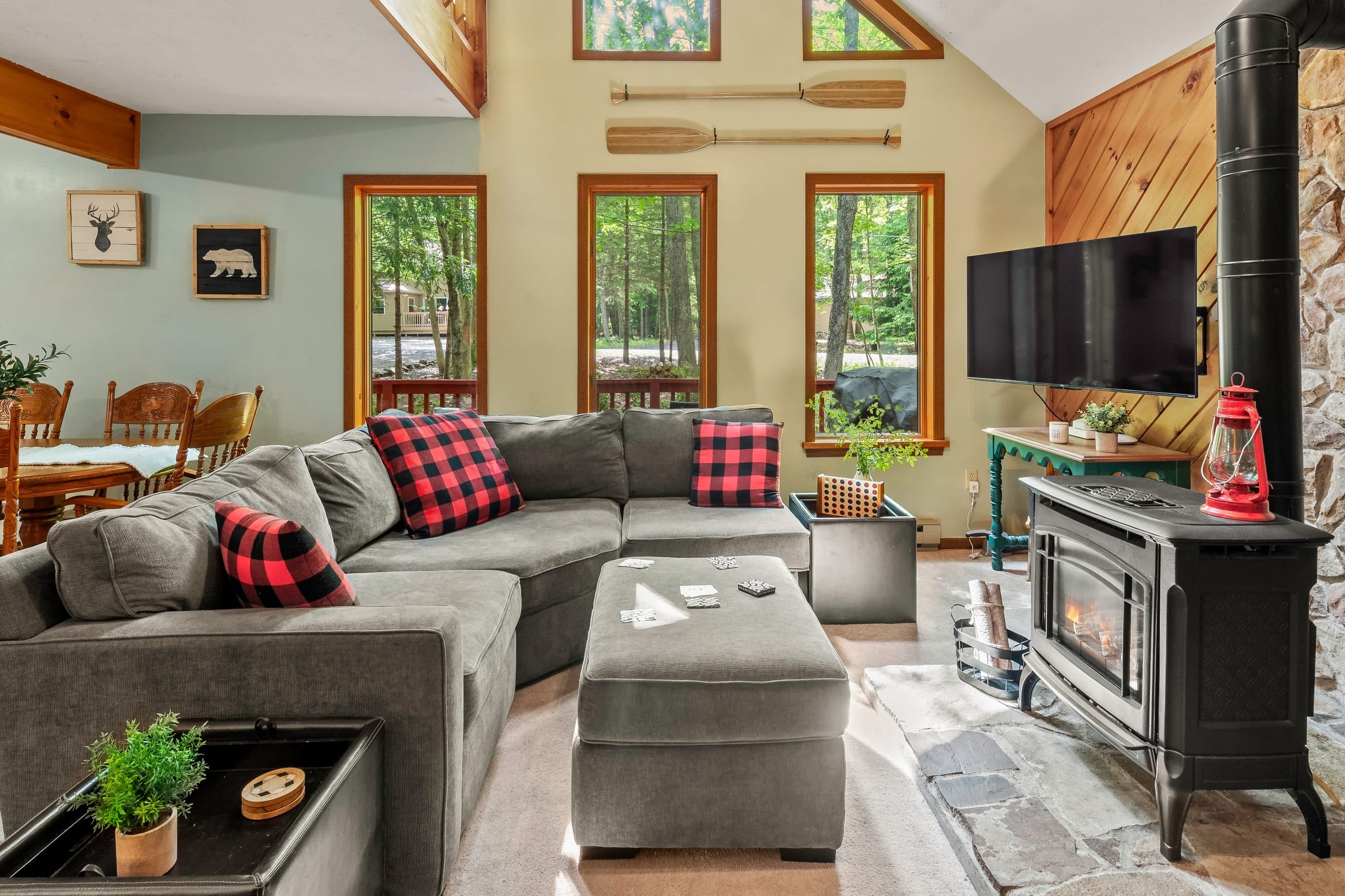 This inviting living room with a designated movie space seems like the perfect place to relax and unwind after a long day.