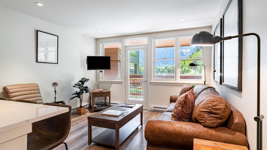 Bright and sunny living area with access to the deck.