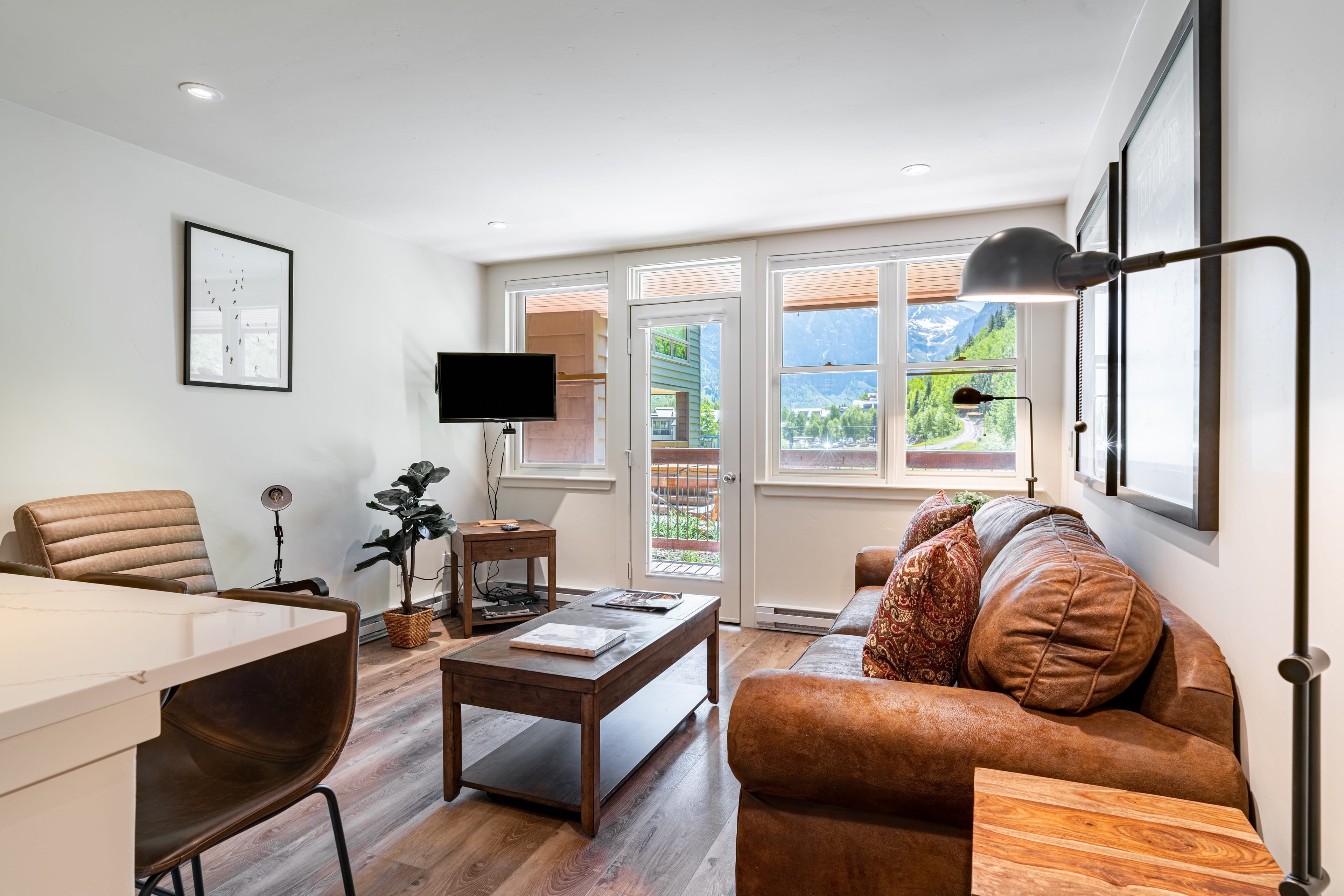 Bright and sunny living area with access to the deck.