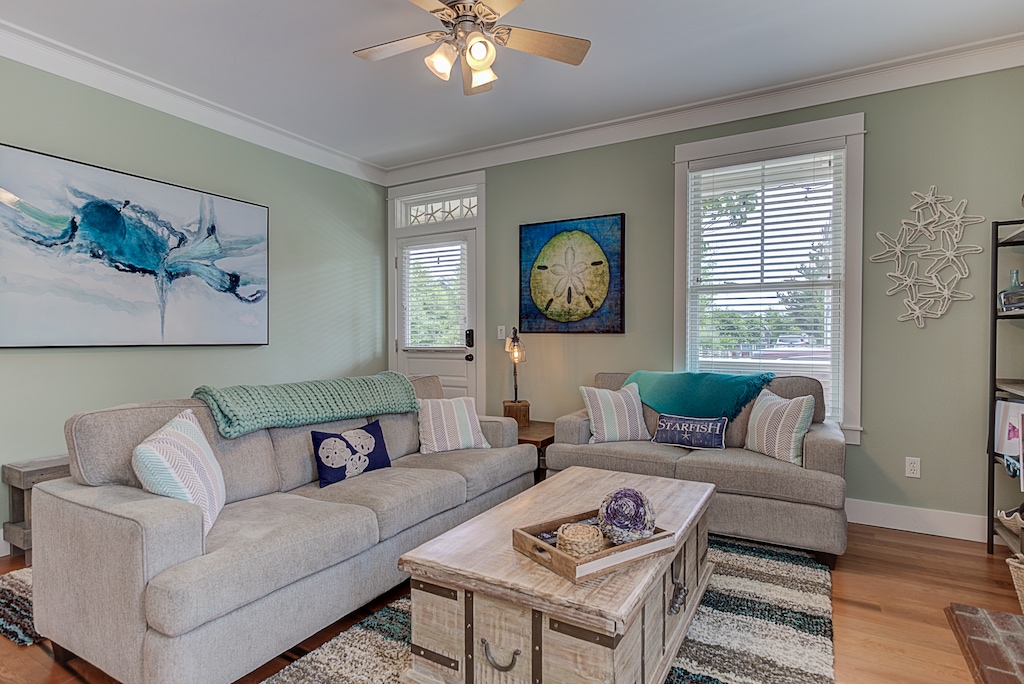 Don’t miss the coffee table that lifts up to make a work surface