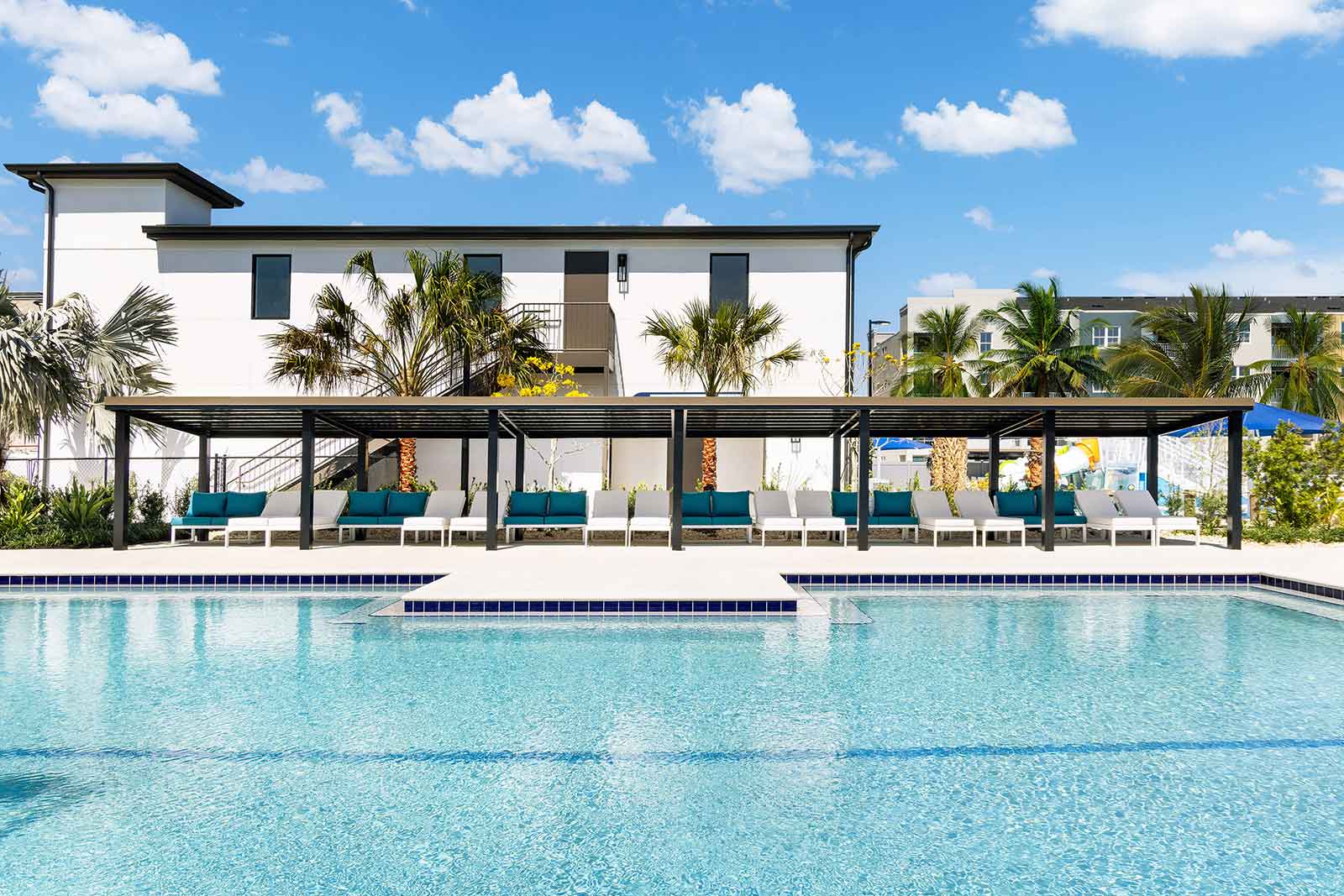 Kick back on plush loungers and enjoy shaded comfort at Aqua Bay