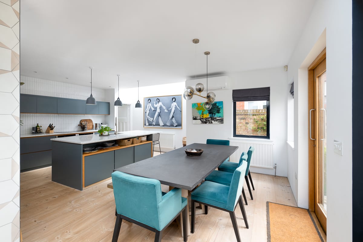 Modern kitchen and dining room combined, featuring sleek appliances, ample counter space, and a stylish dining area perfect for meals and entertaining.