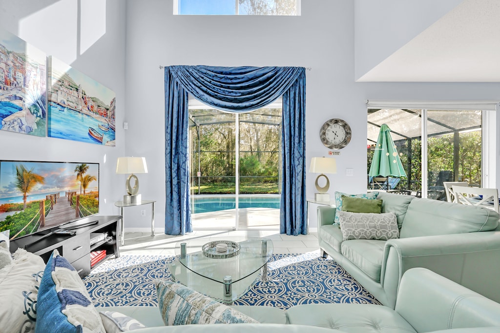 Spacious Living Area of the Home in Kissimmee Florida - Step into the Living Area with a Sliding Door Opening to the Poolside Bliss - Smart TV and Netflix - Comfy Sofas