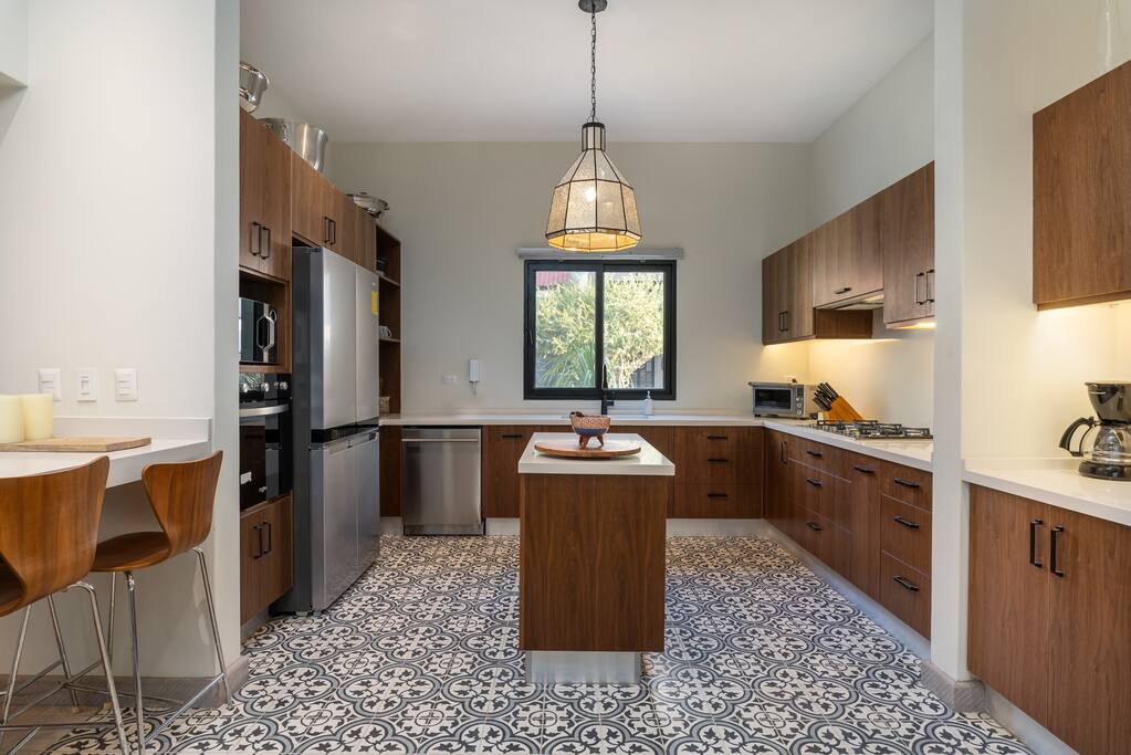 Large kitchen with modern appliances.