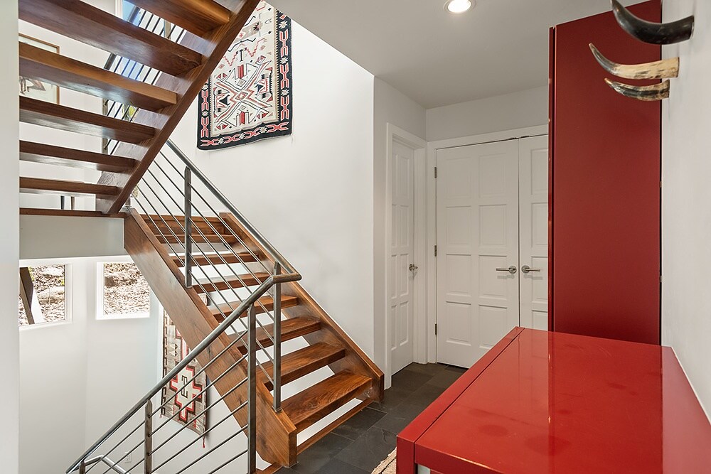 Just a few steps down from the front door offers plenty of storage for jackets, hats and gloves.