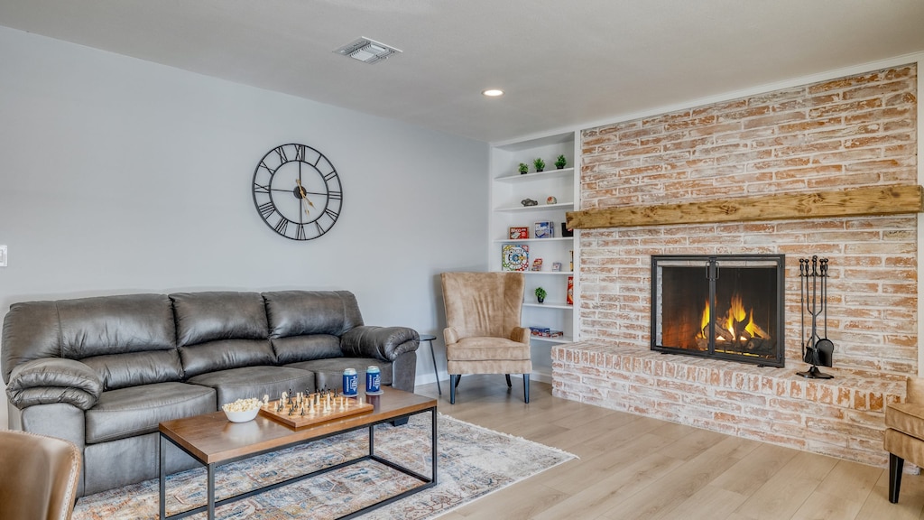 Warm and charming living room with a fireplace.