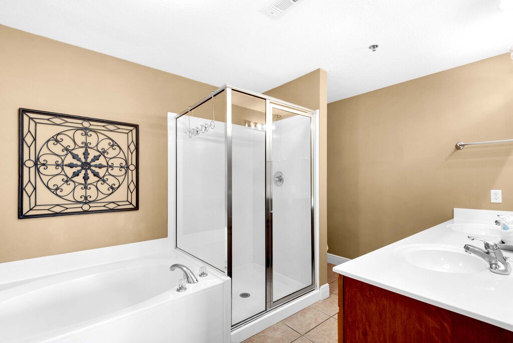 There is a large garden tub and a walk-in shower