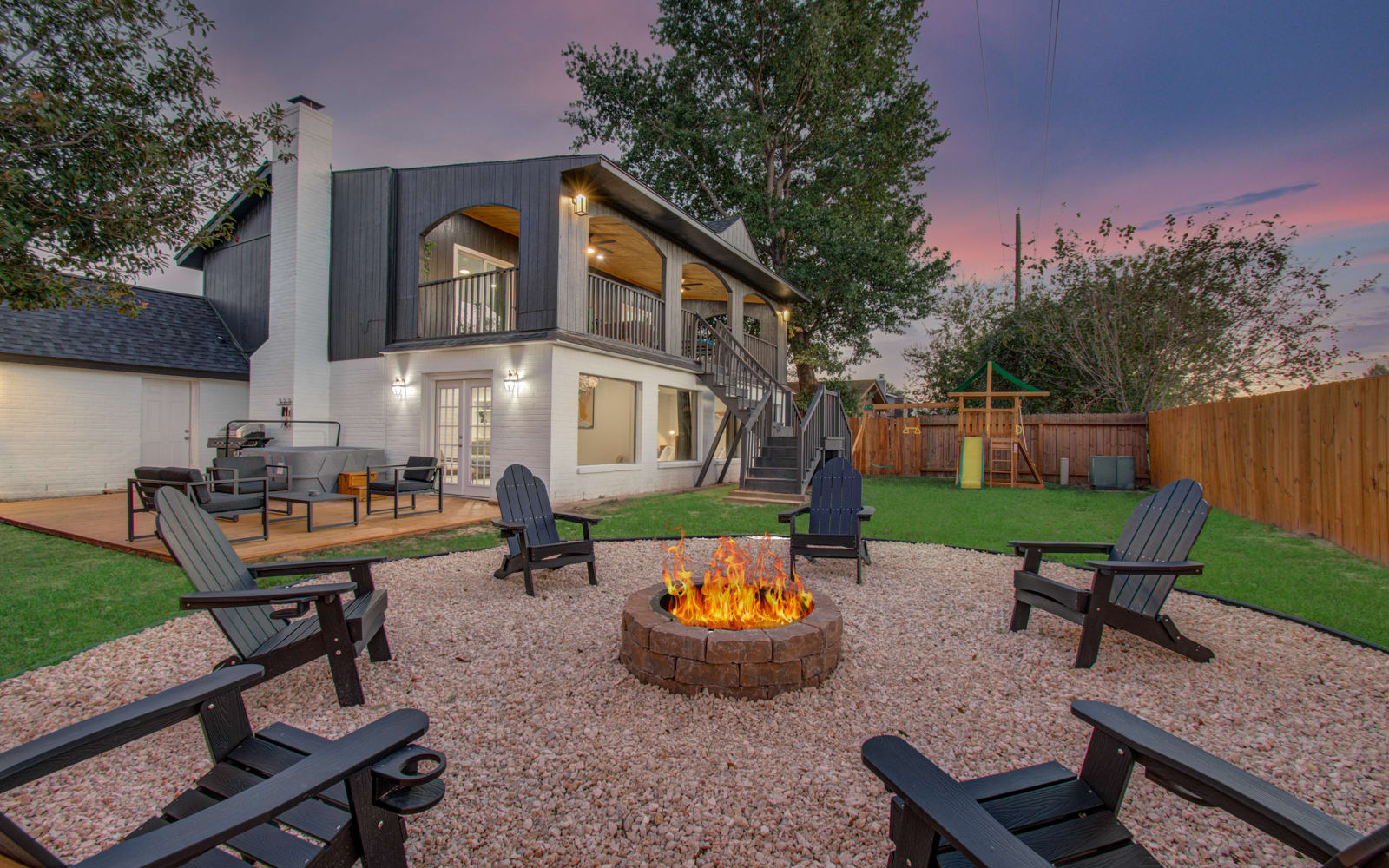 Once you’re done chasing the kiddos up and around the playset, grab a seat in one of the loungers and chat late into the evening while the fire pit keeps you nice and warm.