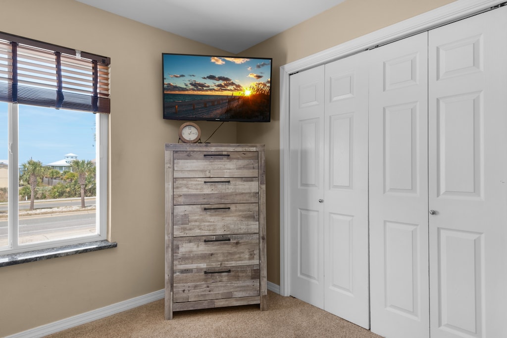 Bunk room with flat screen TV