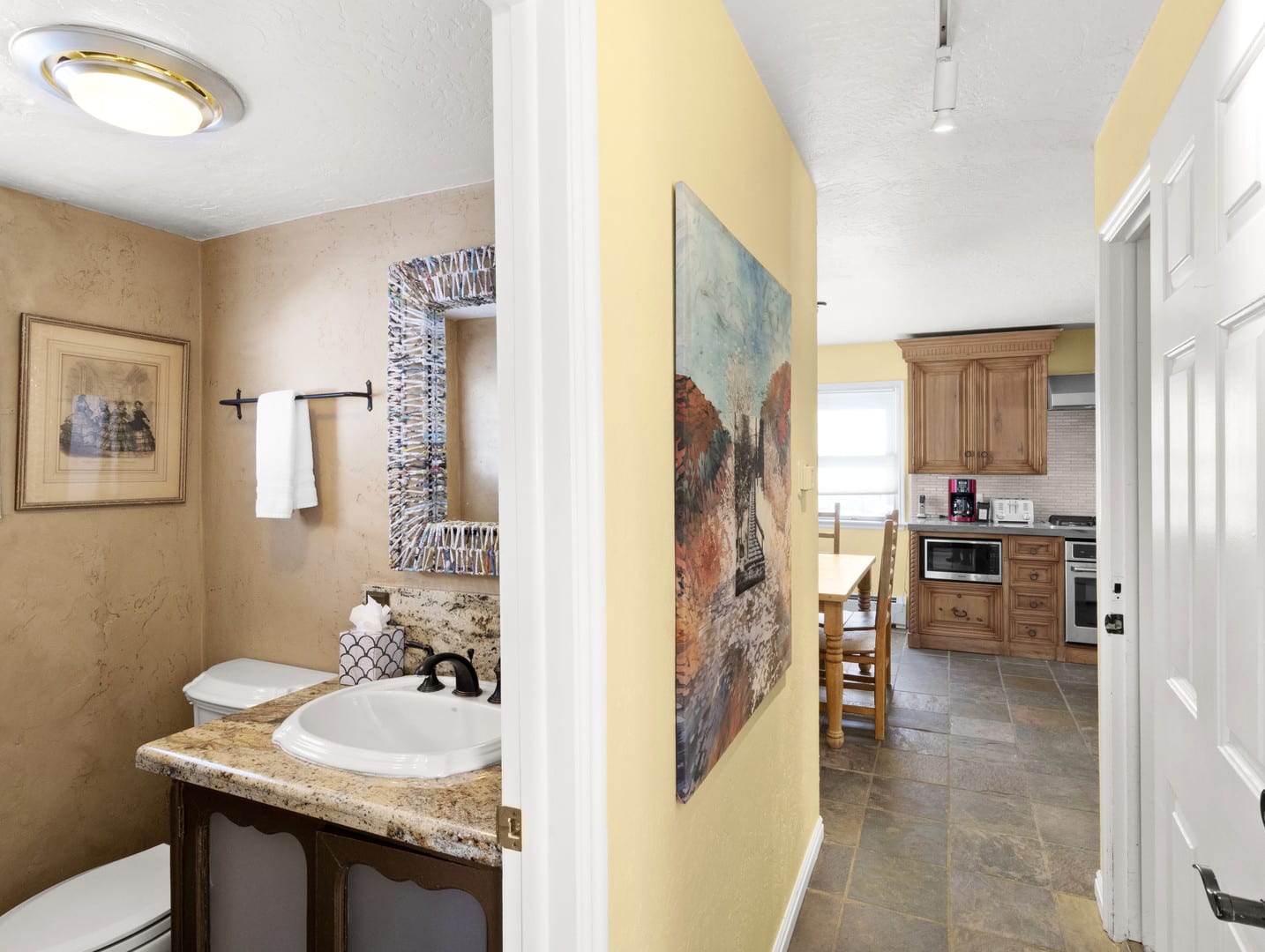 Off the kitchen area you will find a half-bathroom perfect for washing up before meals.