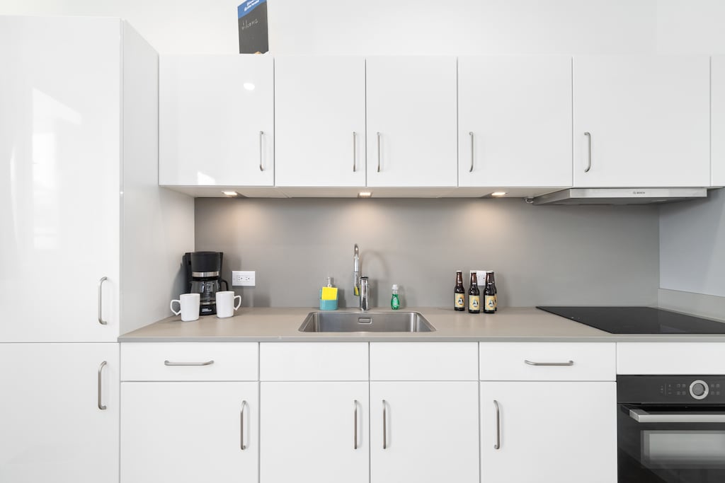 Opulent Kitchen of the Apartment in Noord Aruba - Fully Equipped - Functional layout designed for efficient meal preparation - Smart use of space with versatile storage solutions
