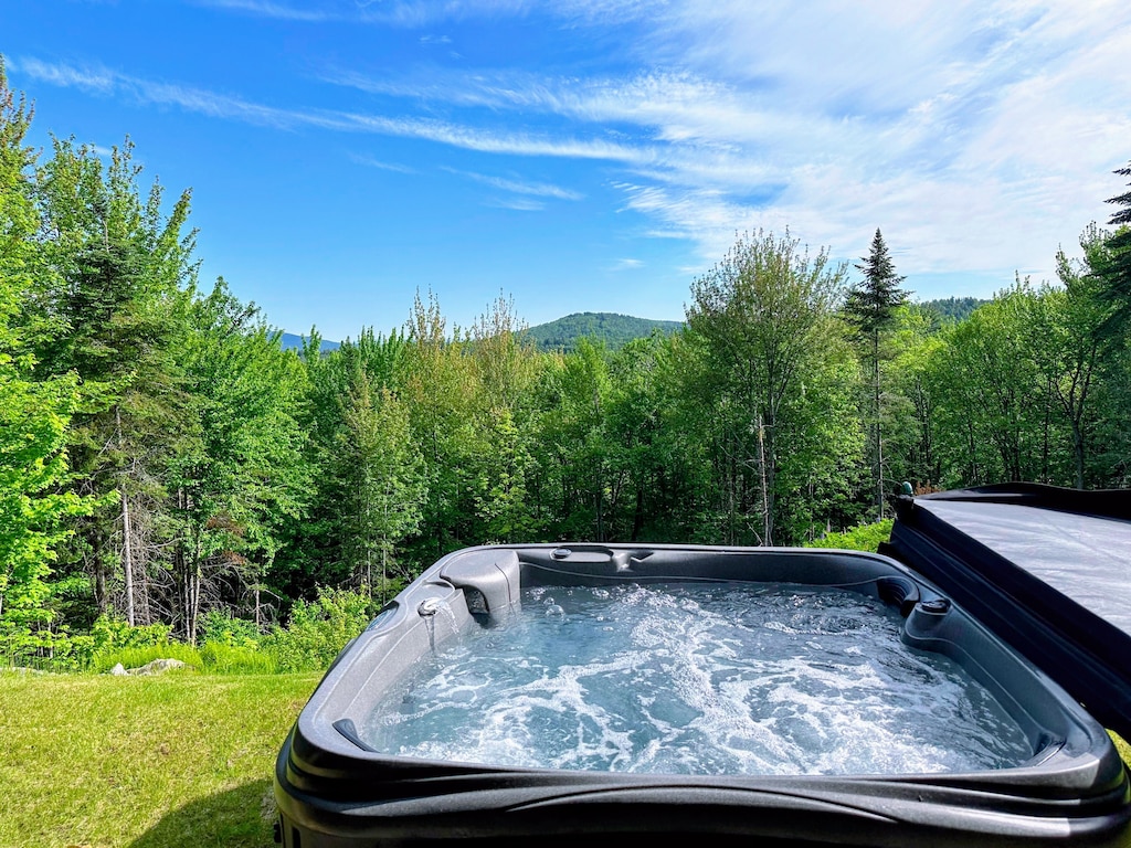 Hot tub off of the lower level walkout with goreous views