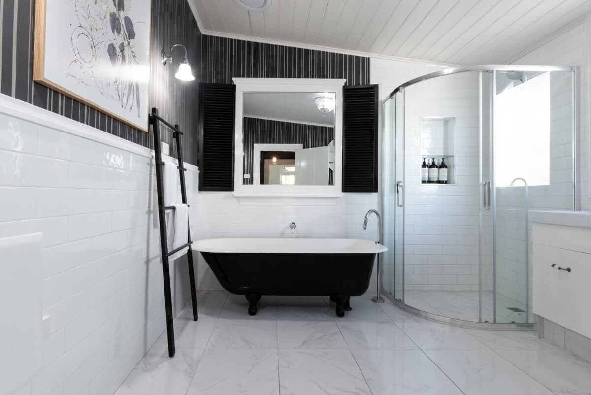 Bathroom featuring a walk-in shower and bath tub